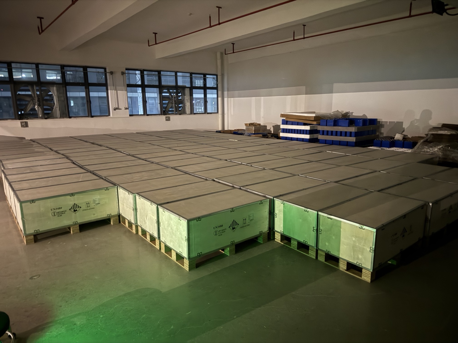Organized battery cell inventory and blue cell modules in the QY ENERGY facility