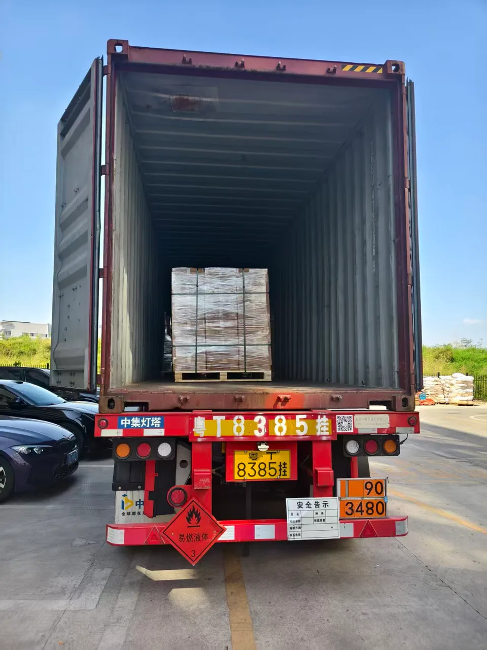Wrapped pallet positioned inside the shipping container.
