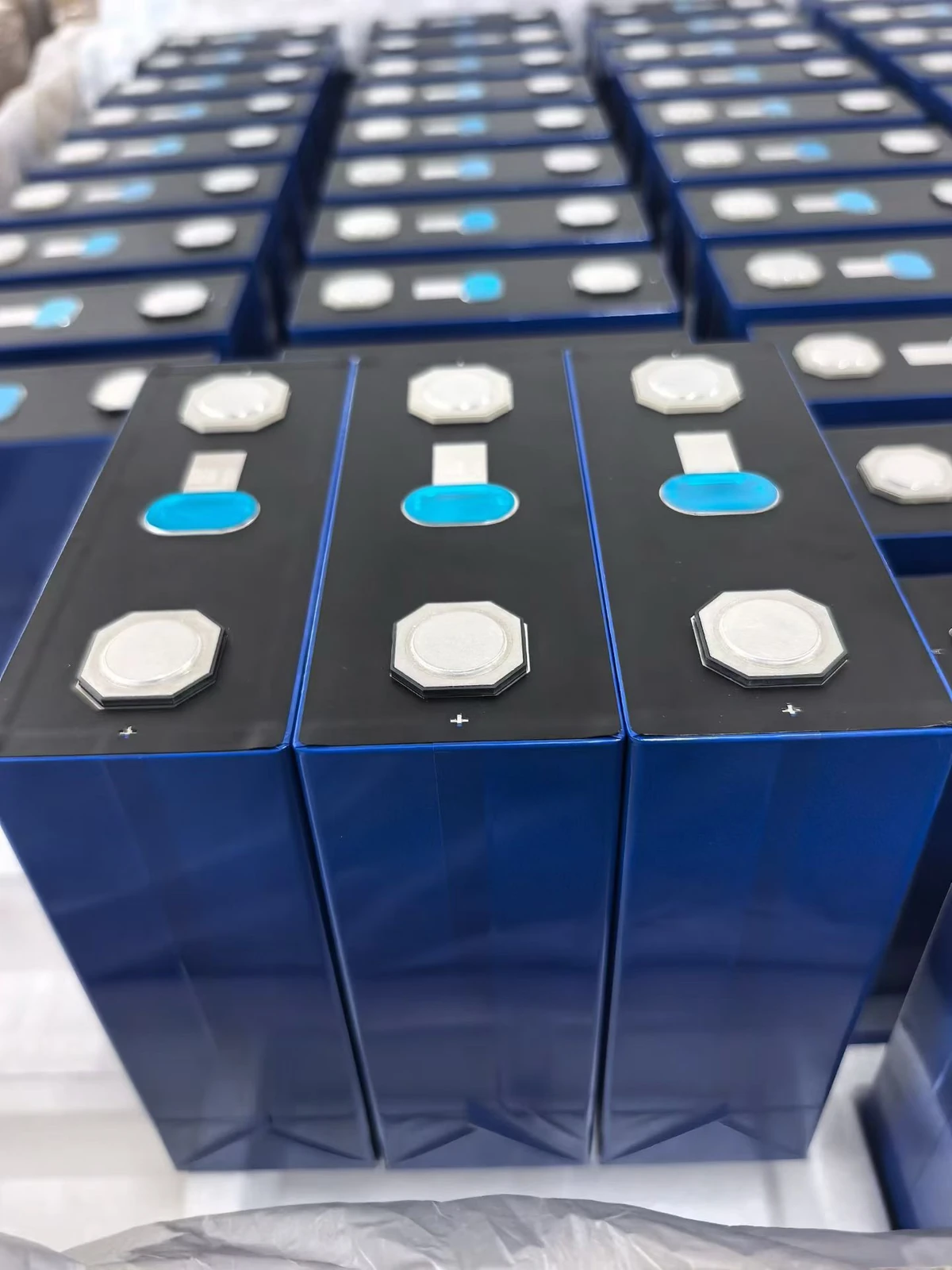 User-supplied photograph of three blue prismatic cells with their complete bodies and terminals visible; identified by the user as 356Ah
